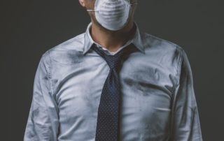 Businessman with mask and air pollution