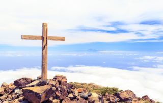 Christian cross on mountain top