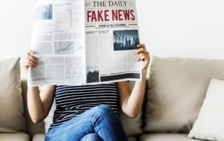 Woman reading newspaper