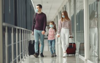 People in airport are wearing masks to protect themselves from virus
