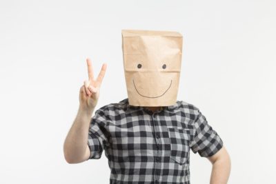 men in paper bag mask hiding identity